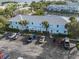 A lovely light-blue condominium complex with a parking area and a view of the canal at 5075 Starfish Se Dr # B, St Petersburg, FL 33705