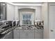 Stylish kitchen sink with granite counters, stainless steel appliances and cabinetry providing a functional cooking space at 5075 Starfish Se Dr # B, St Petersburg, FL 33705