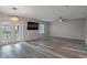 Spacious living room features laminate floors, ceiling fan, and natural light at 5075 Starfish Se Dr # B, St Petersburg, FL 33705