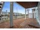 Covered brick patio with white columns overlooks a waterfront view with docks and boats at 5075 Starfish Se Dr # B, St Petersburg, FL 33705