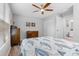Bedroom with wood flooring, ceiling fan, and natural light at 5089 Royal Palms Way # 202, New Port Richey, FL 34652