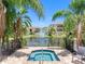 Relaxing spa overlooks a serene pond with a fountain in this community at 5089 Royal Palms Way # 202, New Port Richey, FL 34652