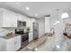 Modern kitchen features stainless steel appliances, granite countertops, and ample cabinet space, designed for cooking at 5089 Royal Palms Way # 202, New Port Richey, FL 34652