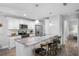 Beautiful kitchen with stainless steel appliances, granite counters and seating at the breakfast bar at 5089 Royal Palms Way # 202, New Port Richey, FL 34652