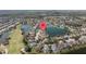 Aerial view of a beautiful residential community next to a golf course and interconnected waterways at 5117 Spectacular Bid Dr, Wesley Chapel, FL 33544