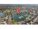 Expansive aerial shot of a residential community, featuring interconnected waterways and lush landscaping at 5117 Spectacular Bid Dr, Wesley Chapel, FL 33544