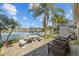 Beautiful backyard patio featuring outdoor seating and views of the lake at 5117 Spectacular Bid Dr, Wesley Chapel, FL 33544
