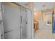 Bathroom with shower featuring a glass door, tile flooring, and vanity at 5117 Spectacular Bid Dr, Wesley Chapel, FL 33544