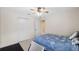 Bedroom featuring a ceiling fan, closet, and comfortable bed at 5117 Spectacular Bid Dr, Wesley Chapel, FL 33544