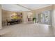 Dining area showcasing tile floors, natural light, and views of the outdoor pool area at 5117 Spectacular Bid Dr, Wesley Chapel, FL 33544