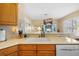 Kitchen sink with views into the living room featuring a view of the pool through the windows at 5117 Spectacular Bid Dr, Wesley Chapel, FL 33544