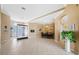 Open living and dining area with tile flooring and neutral decor, perfect for entertaining at 5117 Spectacular Bid Dr, Wesley Chapel, FL 33544