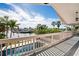 Waterfront balcony view featuring a pool and tranquil canal views with bright blue skies at 5240 Westshore Dr, New Port Richey, FL 34652