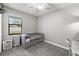 Neutral bedroom showcasing a daybed with storage drawers and a bright window view at 595 Tierra Dr, Spring Hill, FL 34609