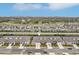 Stunning aerial view of a residential neighborhood with well-maintained homes, tree-lined streets, and community landscaping at 6850 Ripple Pond Loop, Zephyrhills, FL 33541