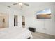 Bright bedroom featuring a ceiling fan, ensuite bathroom and walk-in closet, offering a private retreat at 6850 Ripple Pond Loop, Zephyrhills, FL 33541
