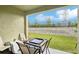 Inviting outdoor patio space with table and chairs, perfect for enjoying the well-maintained backyard at 6850 Ripple Pond Loop, Zephyrhills, FL 33541