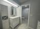 Updated bathroom with modern vanity and a view to the toilet and shower at 700 Starkey Rd # 1525, Largo, FL 33771