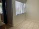 Eat-in kitchen with tile flooring, a window with blinds, and neutral paint at 700 Starkey Rd # 1525, Largo, FL 33771