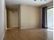 Living room with hardwood floors leading to entryway and patio at 700 Starkey Rd # 1525, Largo, FL 33771