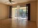 Living room featuring sliding glass doors that lead to a screened-in balcony at 700 Starkey Rd # 1525, Largo, FL 33771