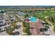 Expansive aerial of the neighborhood featuring tennis courts, pool, golf course, and parking at 7305 River Hammock Dr # 204, Bradenton, FL 34212