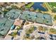 A community aerial view of the tennis courts and nearby water features at 7305 River Hammock Dr # 204, Bradenton, FL 34212