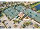 A bird's eye view of the community tennis courts, parking, and gazebo at 7305 River Hammock Dr # 204, Bradenton, FL 34212