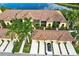 Scenic aerial view of townhomes backing onto a serene lake and lush greenery at 7305 River Hammock Dr # 204, Bradenton, FL 34212