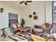 Relax on this outdoor balcony featuring comfortable seating and a beautiful view for a serene experience at 7305 River Hammock Dr # 204, Bradenton, FL 34212