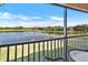 Enjoy the serene lake view from this balcony, a perfect spot to relax and unwind in nature's beauty at 7305 River Hammock Dr # 204, Bradenton, FL 34212