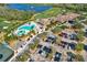 Aerial shot of the community pool, clubhouse, golf course, and ample parking at 7305 River Hammock Dr # 204, Bradenton, FL 34212