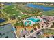 Overhead view of the luxurious community pool, golf course, and convenient parking area at 7305 River Hammock Dr # 204, Bradenton, FL 34212