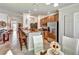 Open kitchen with stainless steel appliances and breakfast bar overlooking the dining area at 7305 River Hammock Dr # 204, Bradenton, FL 34212