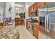 Kitchen showcasing stainless steel appliances, granite countertops, and modern cabinets at 7305 River Hammock Dr # 204, Bradenton, FL 34212