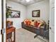 Cozy living room featuring a leather sofa and decorative accents at 7305 River Hammock Dr # 204, Bradenton, FL 34212