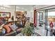Living room and kitchen with modern stainless steel appliances and an outdoor patio at 7305 River Hammock Dr # 204, Bradenton, FL 34212