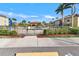 Community pool area surrounded by tropical landscaping, perfect for relaxation and recreation at 7305 River Hammock Dr # 204, Bradenton, FL 34212