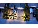 Aerial view of a home featuring a two-car driveway, landscaped yard, and street views at 7309 Islander Ln, Hudson, FL 34667