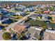 Community aerial view showcasing waterfront homes along canals with boat docks and lush landscaping at 7309 Islander Ln, Hudson, FL 34667