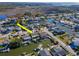 Charming waterfront property, highlighted by an arrow, featuring a private dock on a serene canal at 7309 Islander Ln, Hudson, FL 34667