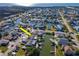 Aerial view of a waterfront home with private dock and beautiful water access, highlighted by a yellow arrow at 7309 Islander Ln, Hudson, FL 34667