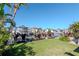 Spacious backyard with mature palm trees overlooking the canal, with boat dock access at 7309 Islander Ln, Hudson, FL 34667