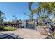 Waterfront home features a dock, patio, and lush tropical landscaping on a canal with boat access at 7309 Islander Ln, Hudson, FL 34667
