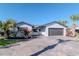 Single-Gathering home with well-maintained landscaping, two-car garage, and welcoming curb appeal at 7309 Islander Ln, Hudson, FL 34667