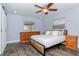 Inviting main bedroom with wood floors, neutral decor, and comfortable furnishings at 7309 Islander Ln, Hudson, FL 34667