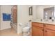 Bathroom with a shower/tub and a vanity with a mirror and an adjacent toilet at 8403 Grand Estuary Trl # 204, Bradenton, FL 34212