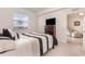 Bright bedroom featuring a large window with a view and access to an adjacent sitting area at 8403 Grand Estuary Trl # 204, Bradenton, FL 34212