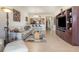 Spacious living room with a large built-in entertainment center and a clear view of the kitchen at 8403 Grand Estuary Trl # 204, Bradenton, FL 34212