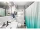 Cozy bathroom featuring a white vanity, shower-tub combo, and modern fixtures at 908 Woodley Rd, Clearwater, FL 33764